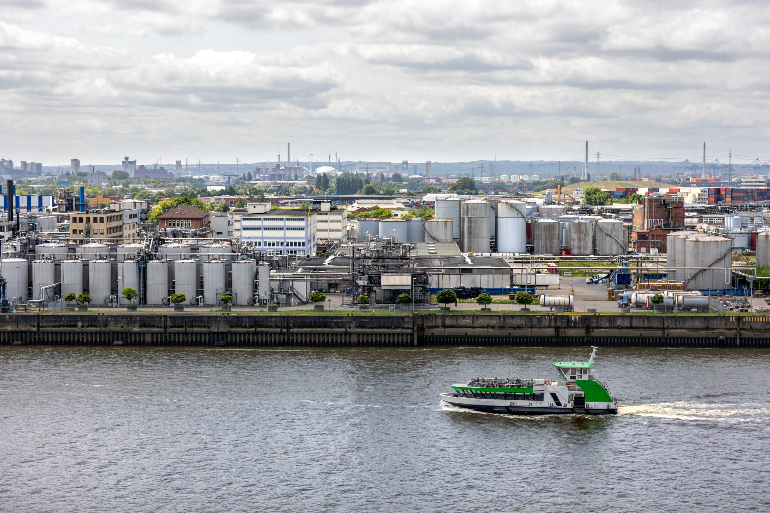 Industrial panorama. River transport. Factory zone.
